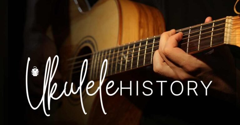 A presentation slide titled "Ukulele History" showing a close-up of hands playing a wooden string instrument, with elegant white typography on a dark background illuminated by warm lighting.